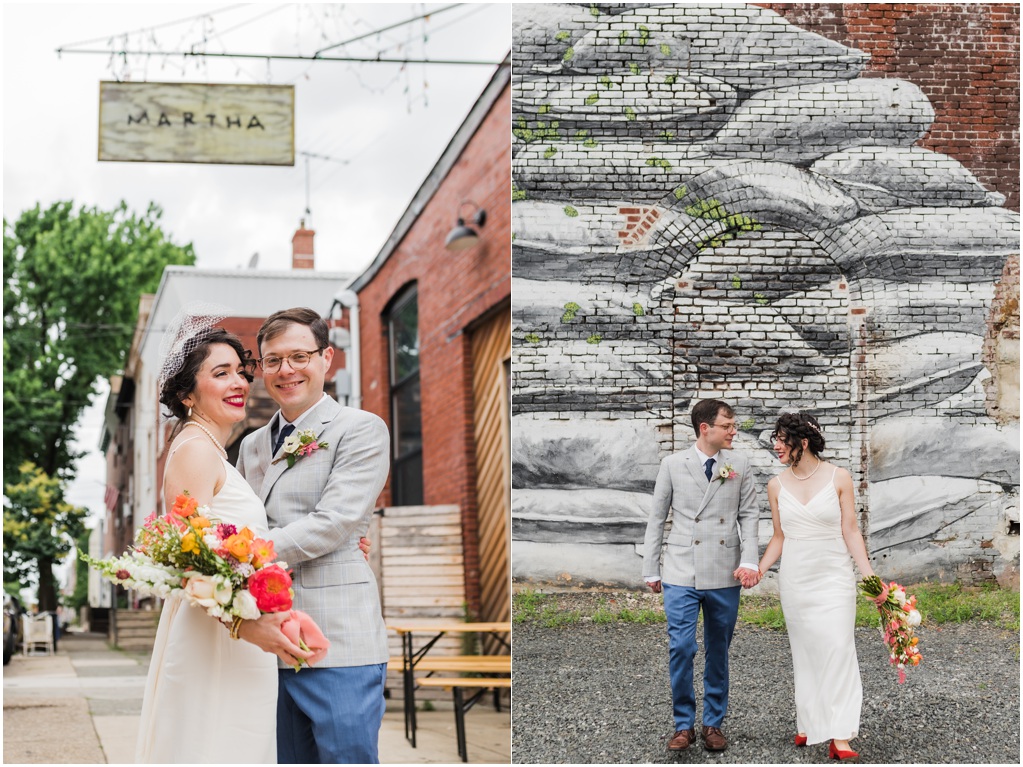 The couple poses in front of the Martha sign and a mural