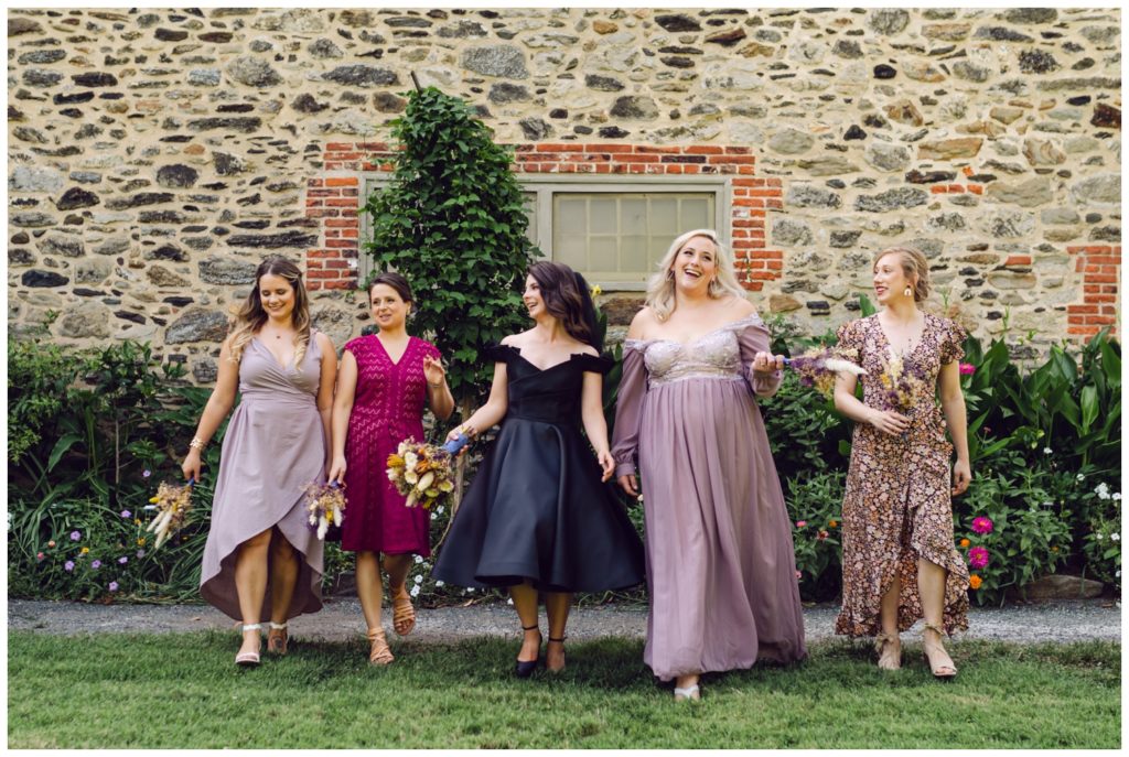 The bridal party wears purple