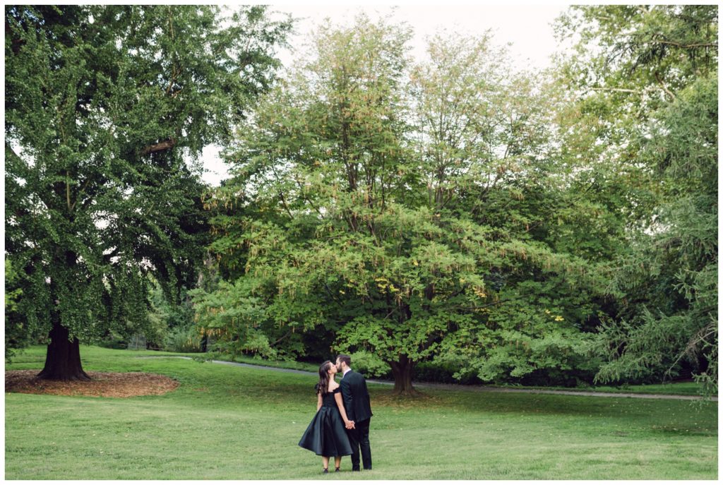 The couple explores a meadow at the Bartram's Garden wedding