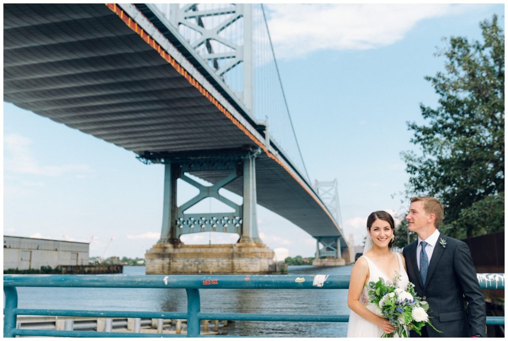 The bridge and river behind the couple before the Power Plant Productions wedding