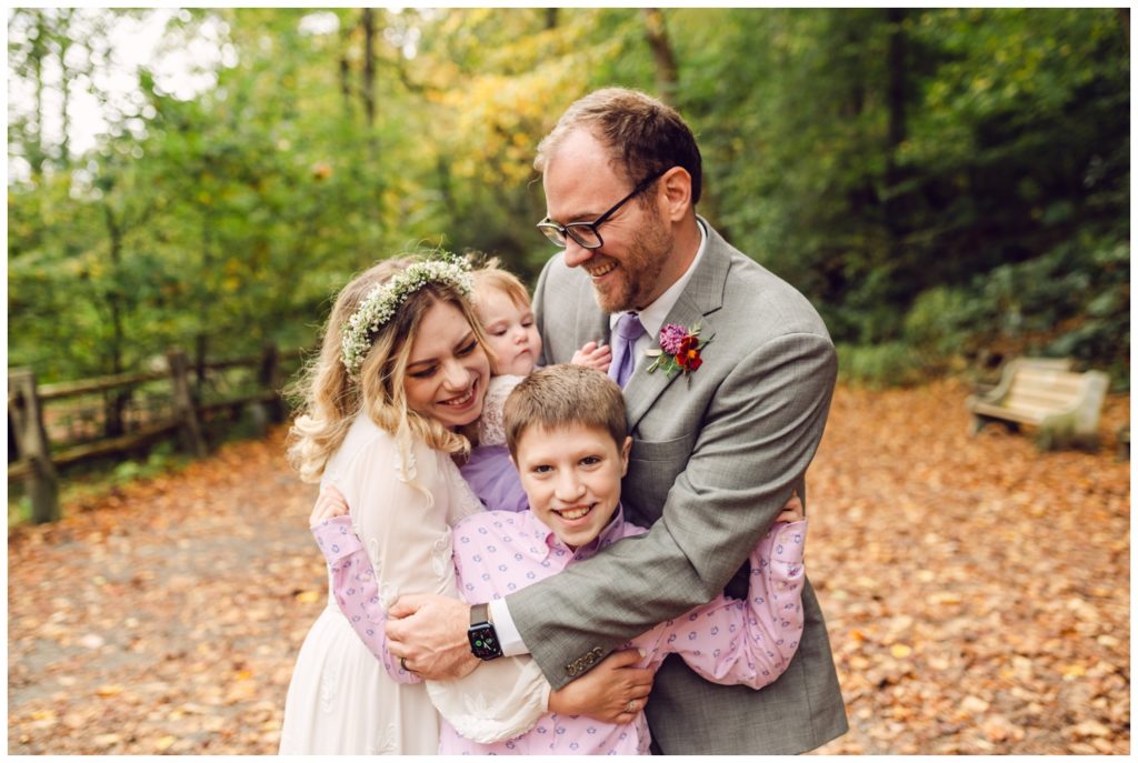 The couple embraces children at the Valley Green Inn wedding