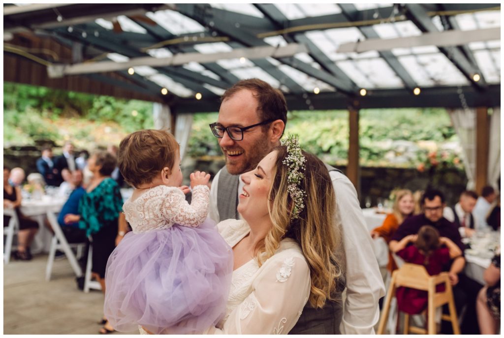 The couple dances with their daughter at the Valley Green Inn wedding