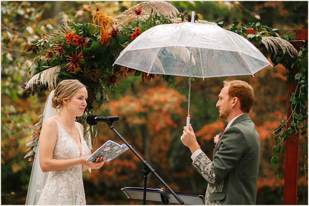 A bride reads vows at a Valley Green Inn wedding ceremony.