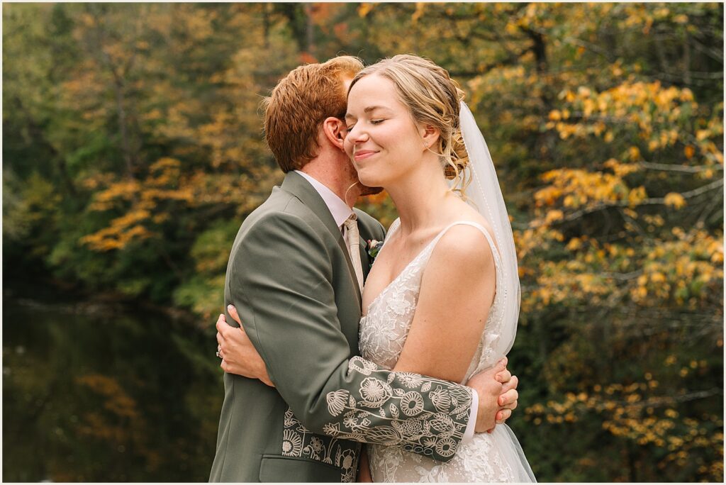 A bride and groom hug.
