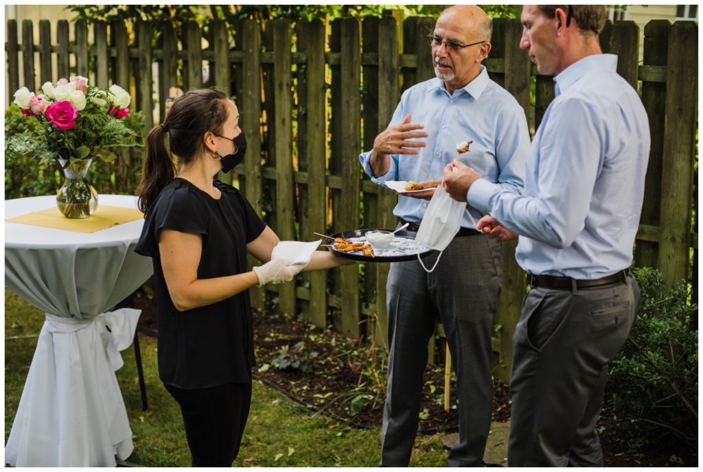 ideas for backyard wedding - staff serves appetizers