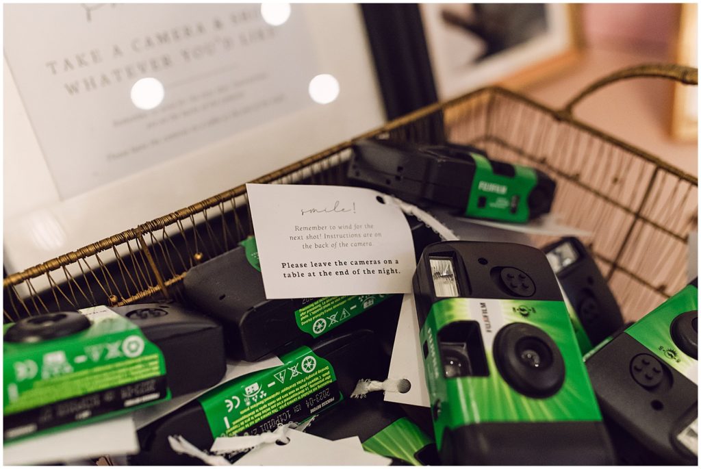 Green instant film cameras sit in a basket.