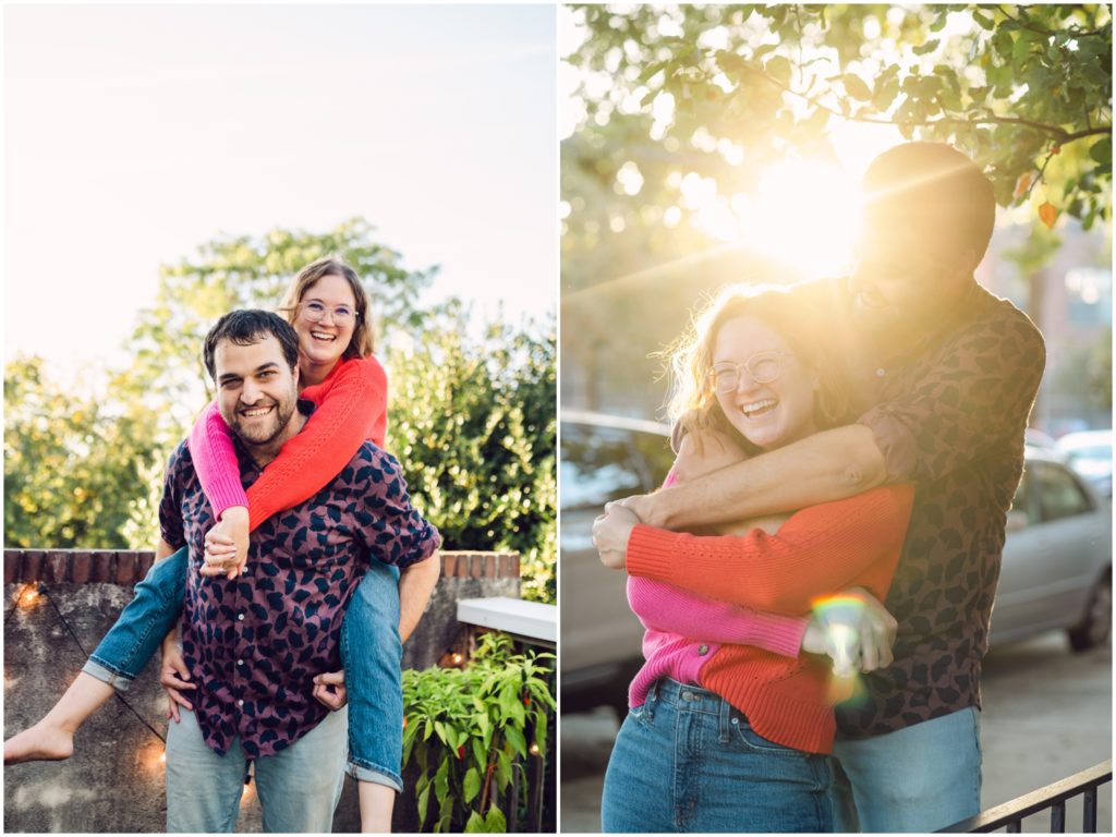 A woman puts her arms around her fiance's shoulders in their Philadelphia engagement photos on their balcony.