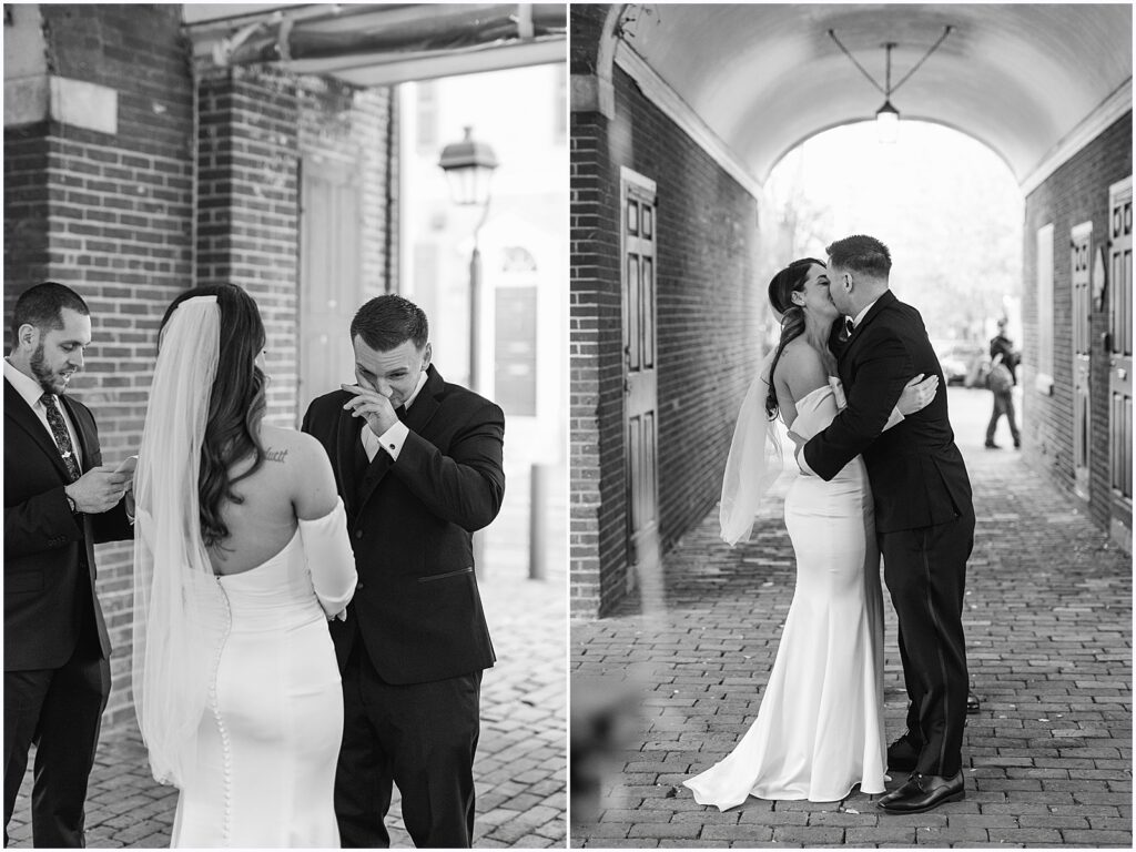 A bride and groom kiss under an arched walkway at their Philadelphia elopement.