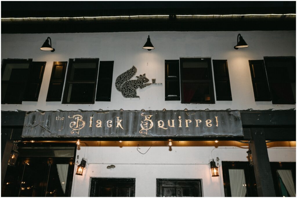 A sign reads "The Black Squirrel."