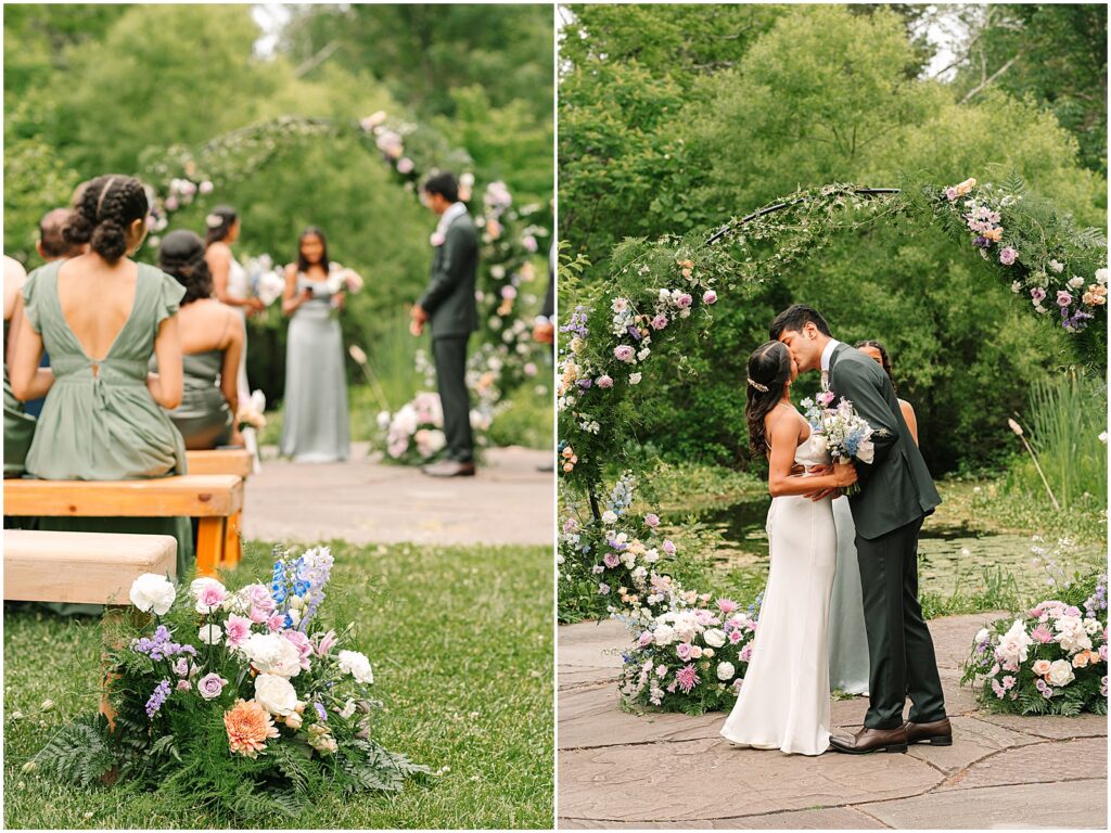 A bride and groom kiss beneath a floral arch at their Bowman's Hill Wildflower Preserve wedding.