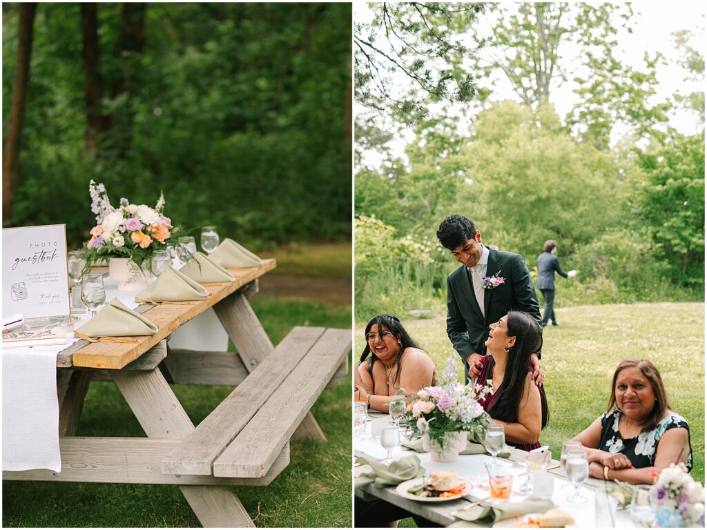 Flowers and green napkins sit on a picnic table decorated for a summer wedding.