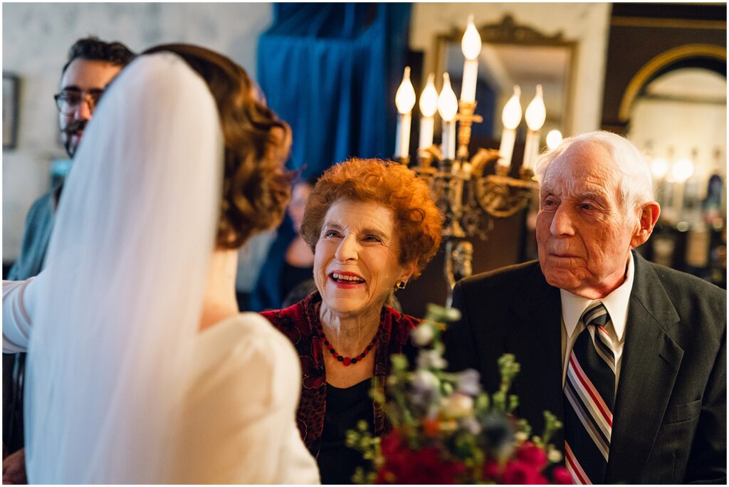 Wedding guests greet a bride.