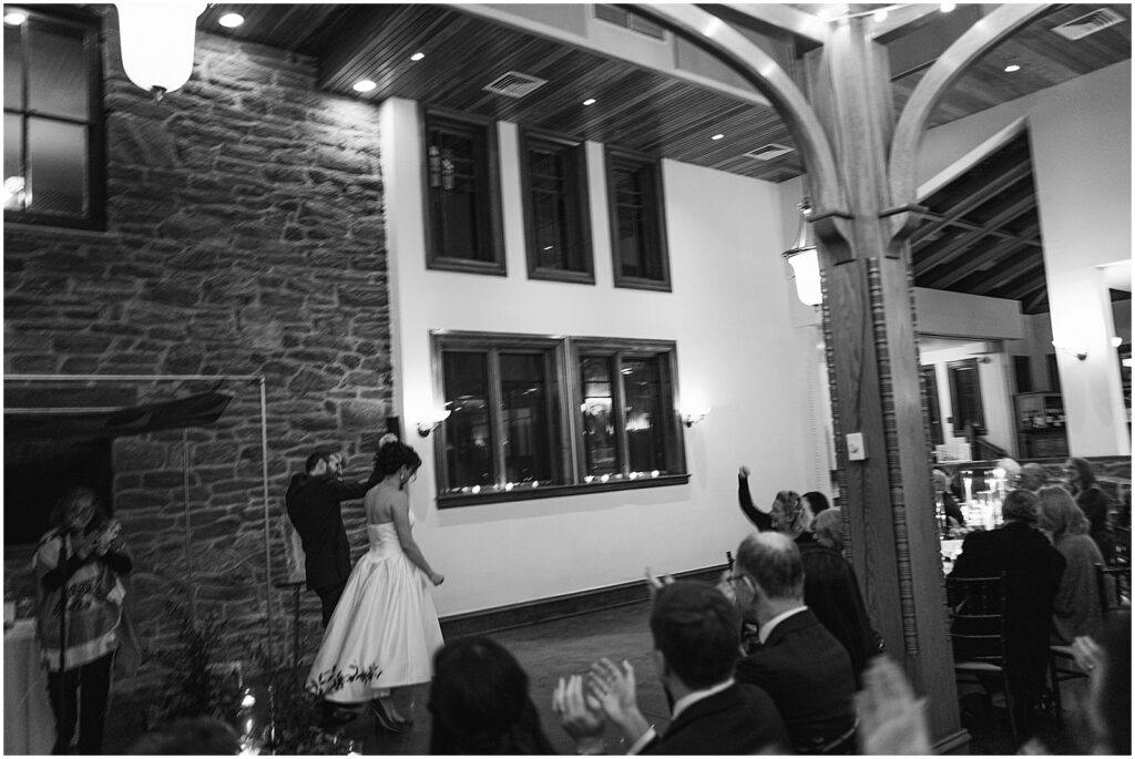 A bride and groom exit their wedding ceremony.