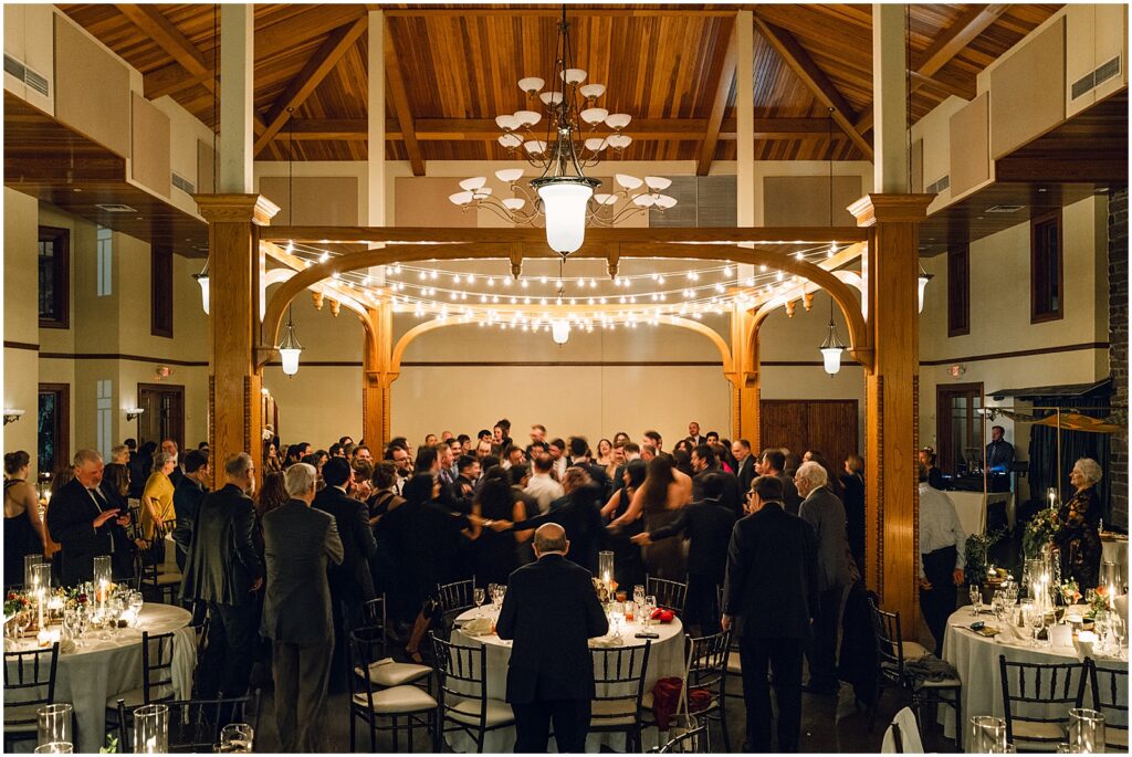 Wedding guests dance in the ballroom at Knowlton Mansion.