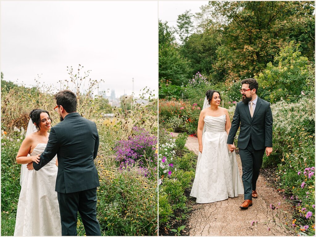 A bride and groom hold hands and walk down a path at Bartram's Garden.