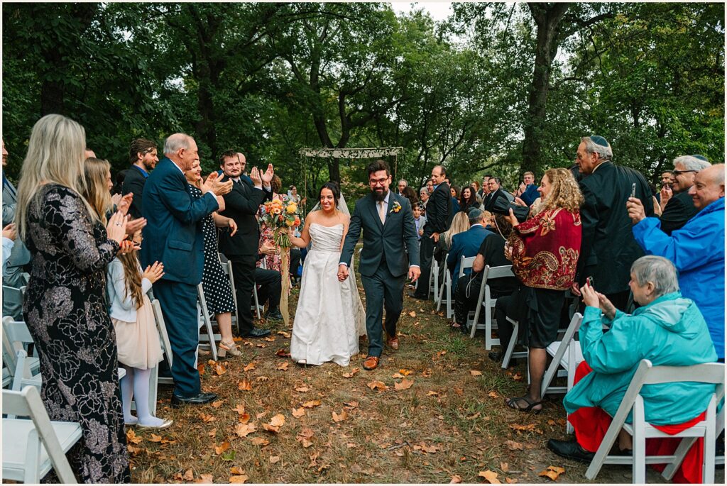 A bride and groom walk their recessional.