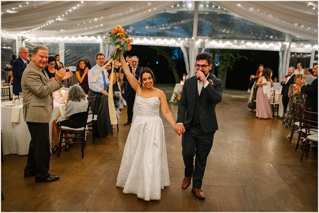 A bride and groom make their entrance.