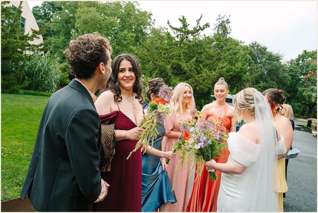 A bride chats with her wedding party.