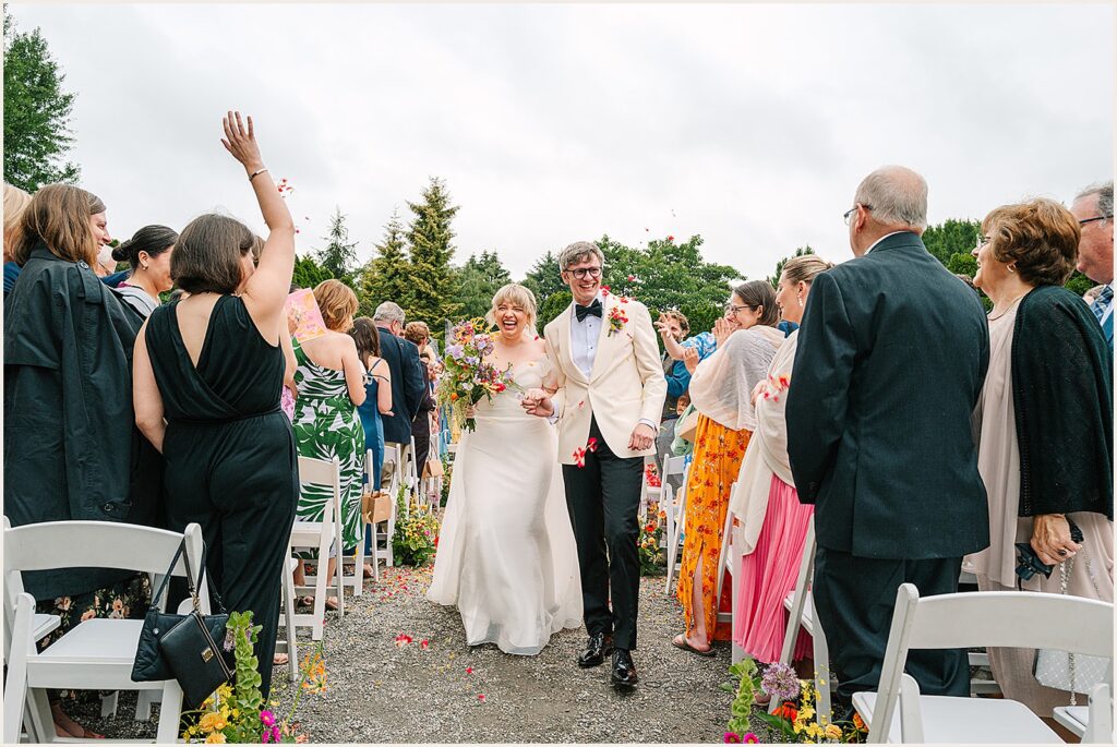 A bride and groom walk their recessional.