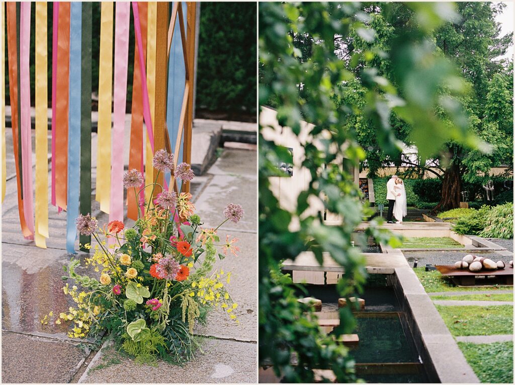 A bride and groom stand beside a reflecting pool.