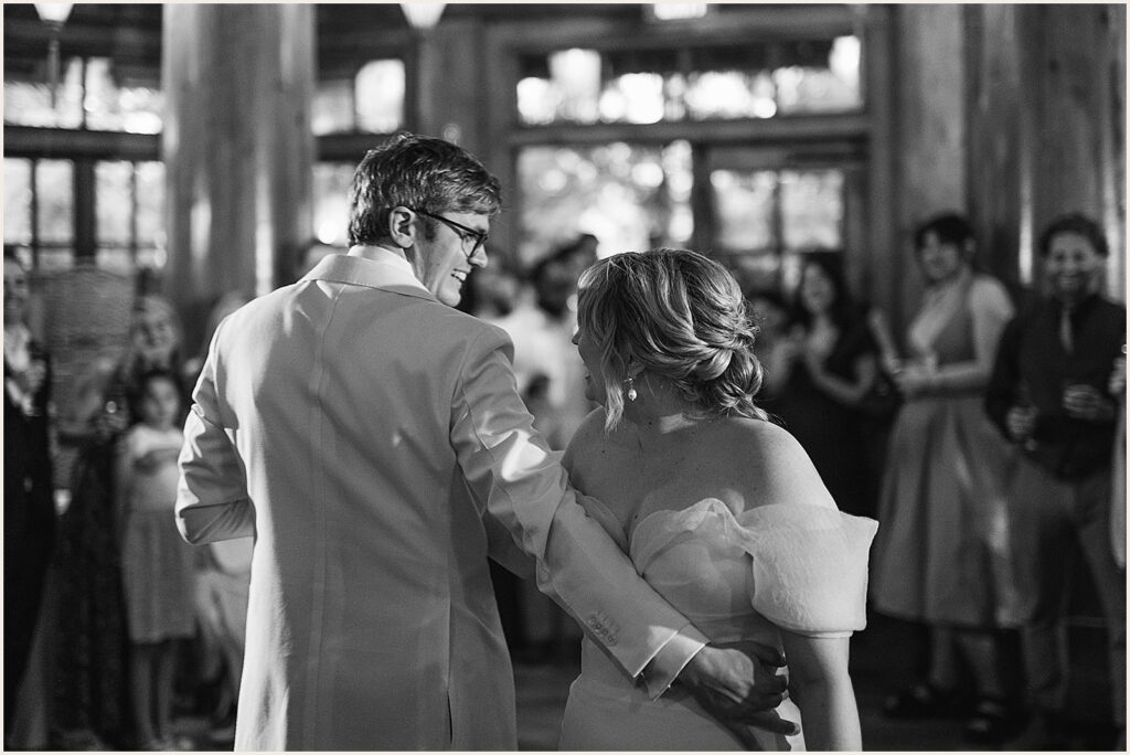 A bride and groom share their first dance.