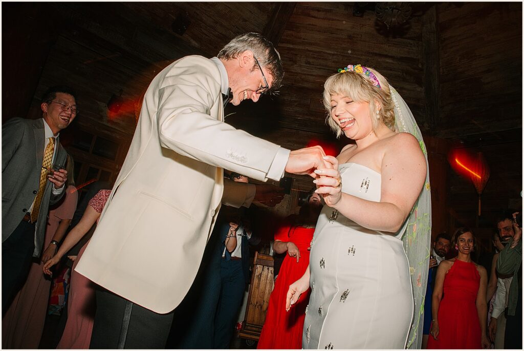 A bride and groom dance at their reception.