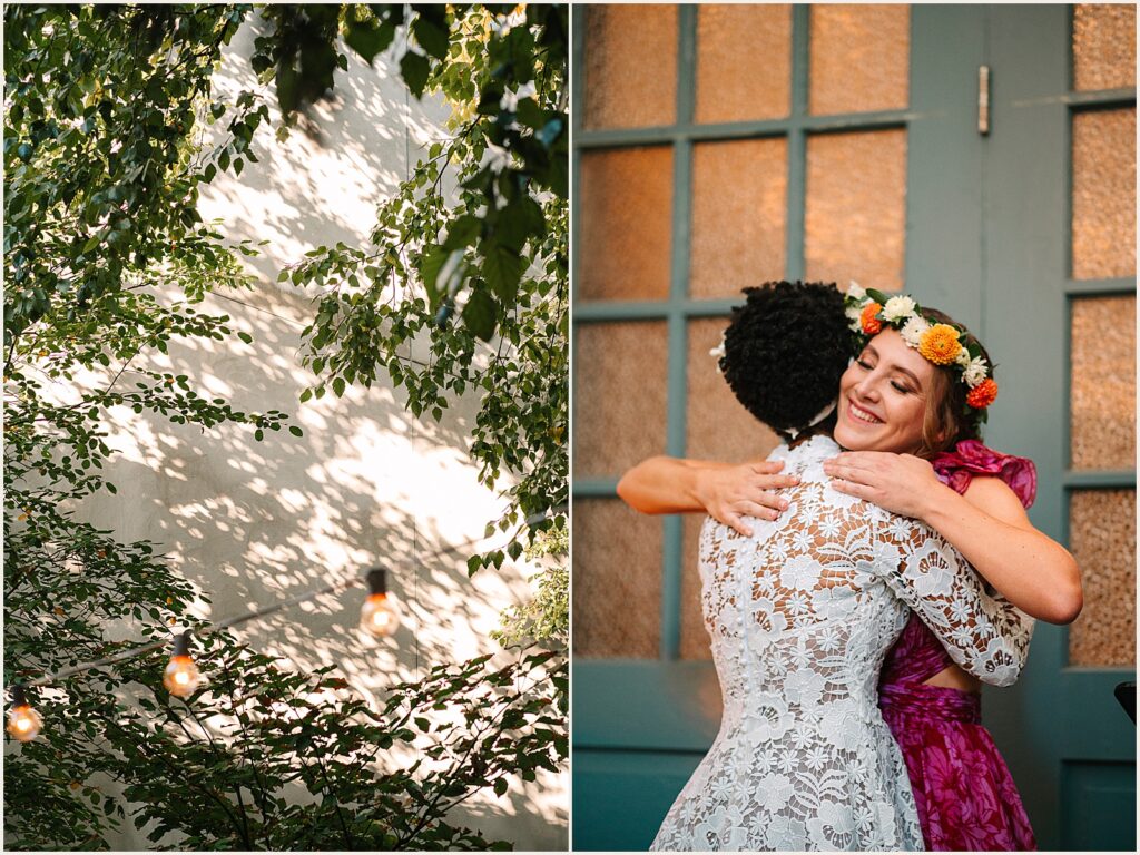 A bridesmaid in a flower crown hugs a bride.