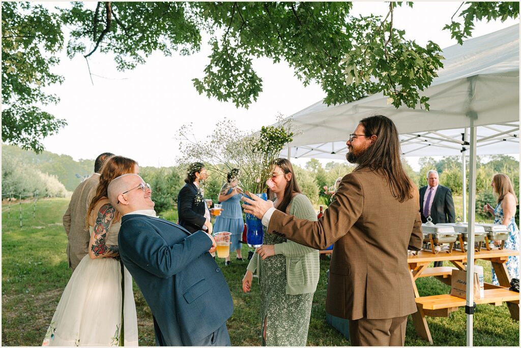 A groom speaks with friends.