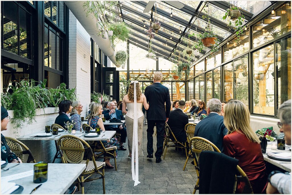 A bride's father walks her up the aisle at Osteria Philadelphia.