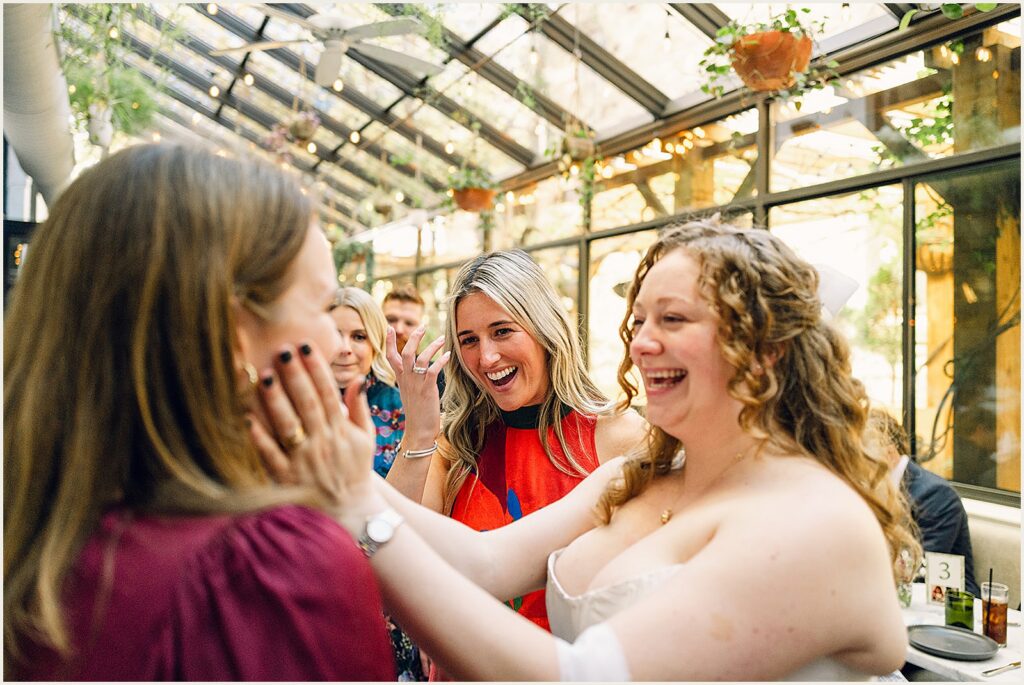 Wedding guests greet a bride.