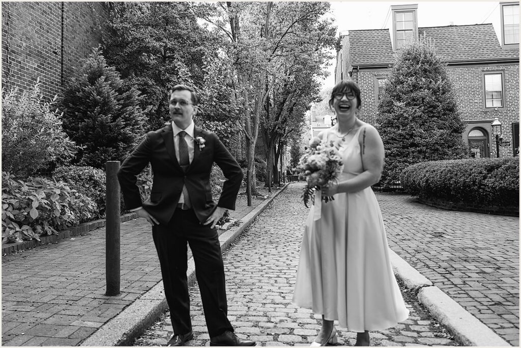 A bride and groom laugh at a Philadelphia wedding photographer.
