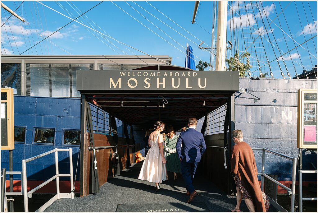 A bride and groom board Moshulu Philadelphia.