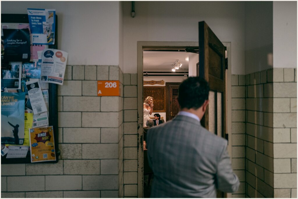 A groom walks through the gym of the BOK Building.