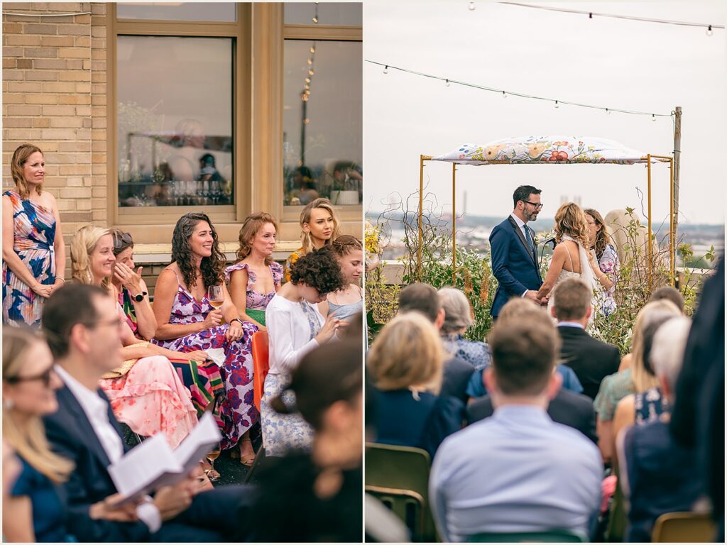 Guests smile during a rooftop wedding.