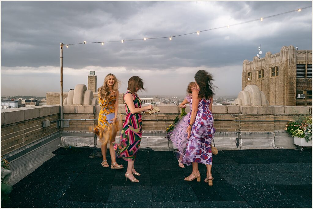 Wedding guests talk as a storm blows in.