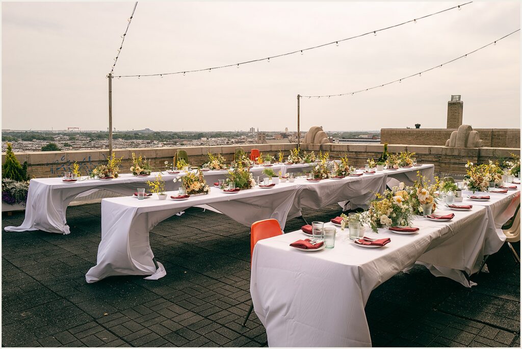 Tables are set for an outdoor reception at the BOK building.